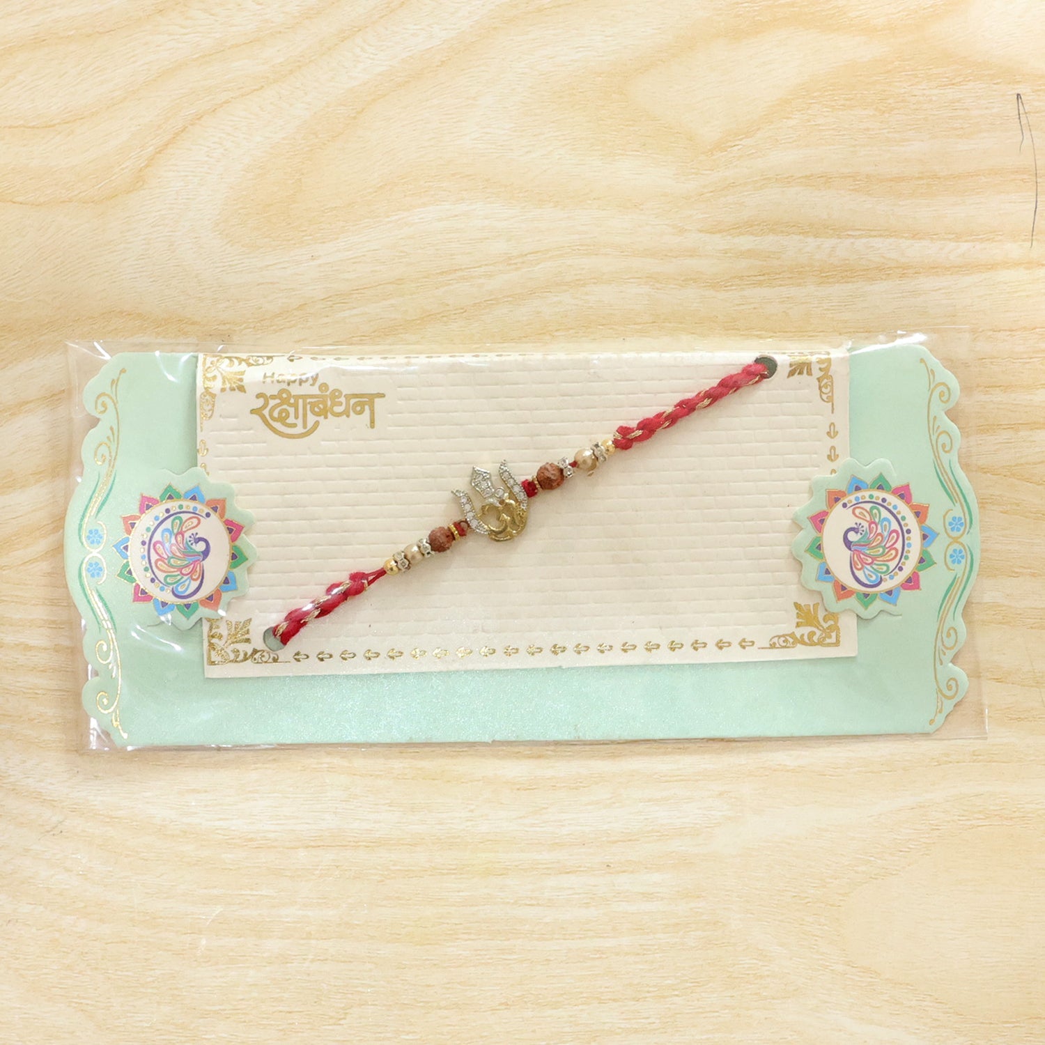 Auspicious Trishul Om Diamond Rakhi with Pearls – Rakhi for Brother