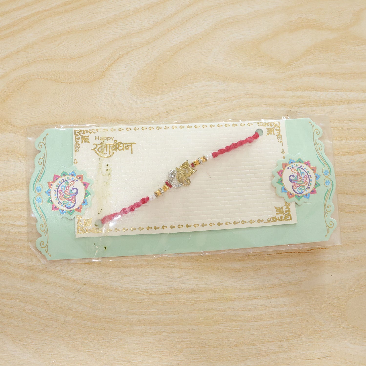 Religious Ganpati Diamond Rakhi with Pearl Beads Rakhi for Brother