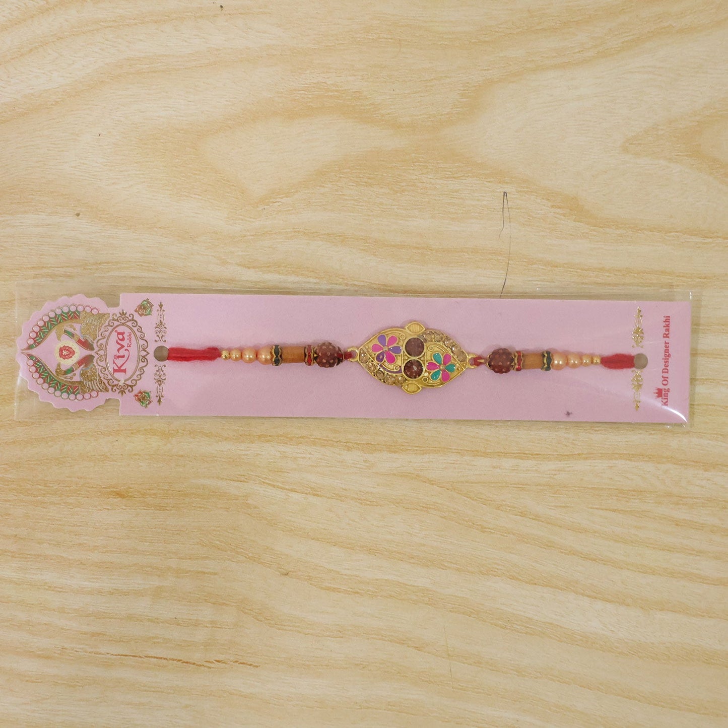 Designer Enamel Flower Rakhi with Rudraksha Beads – Rakhi for Brother