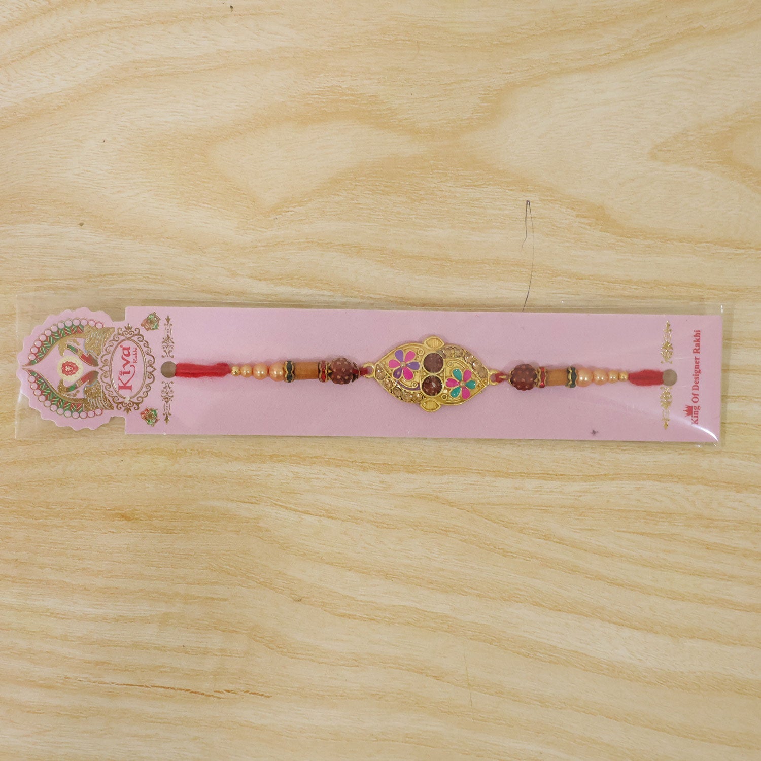 Designer Enamel Flower Rakhi with Rudraksha Beads – Rakhi for Brother