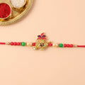 Ganesha Rakhi for Brother - Red Green Beads Festive Design