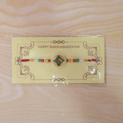 Religious Om Round Rakhi with Meenakari & Pearls – Rakhi for Brother