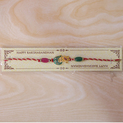 Golden Paisley Meenakari Rakhi with Stones & Beads – Rakhi for Brother
