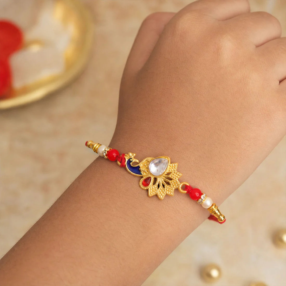 Peacock Feather Rakhi for Brother – Stone Studded Design