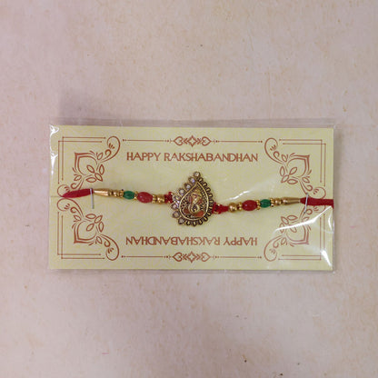 Antique Golden Ganesha Rakhi with Red & Green Beads and Crystals