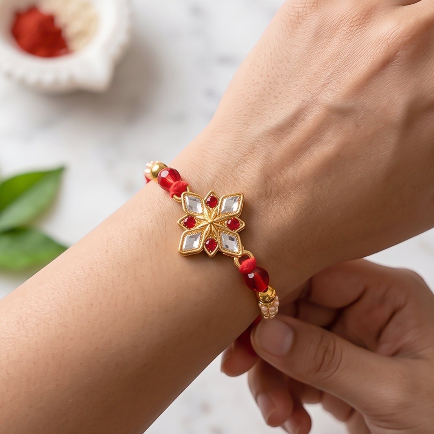 Designer Golden Ganesha Rakhi with Red & Green Beads for Brother | Raksha Bandhan Special