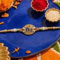 Round Om Designer Rakhi with Pearl Beaded Festive Detail
