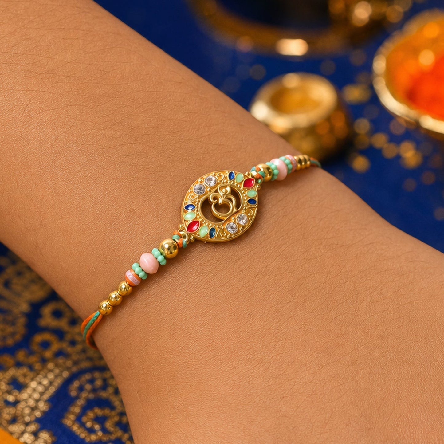 Round Om Designer Rakhi with Pearl Beaded Festive Detail