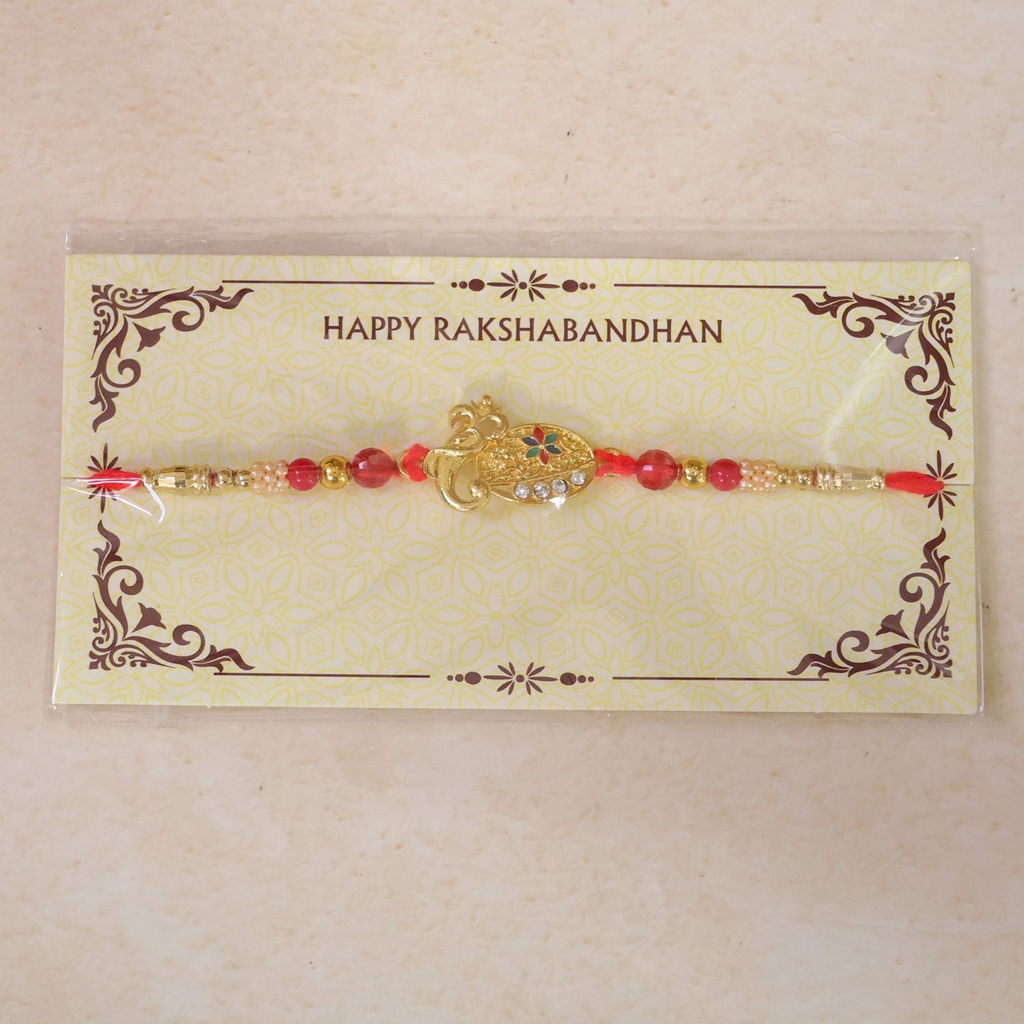 Stylish Om Shape Kundan Designer Rakhi with Beaded Festive Detail