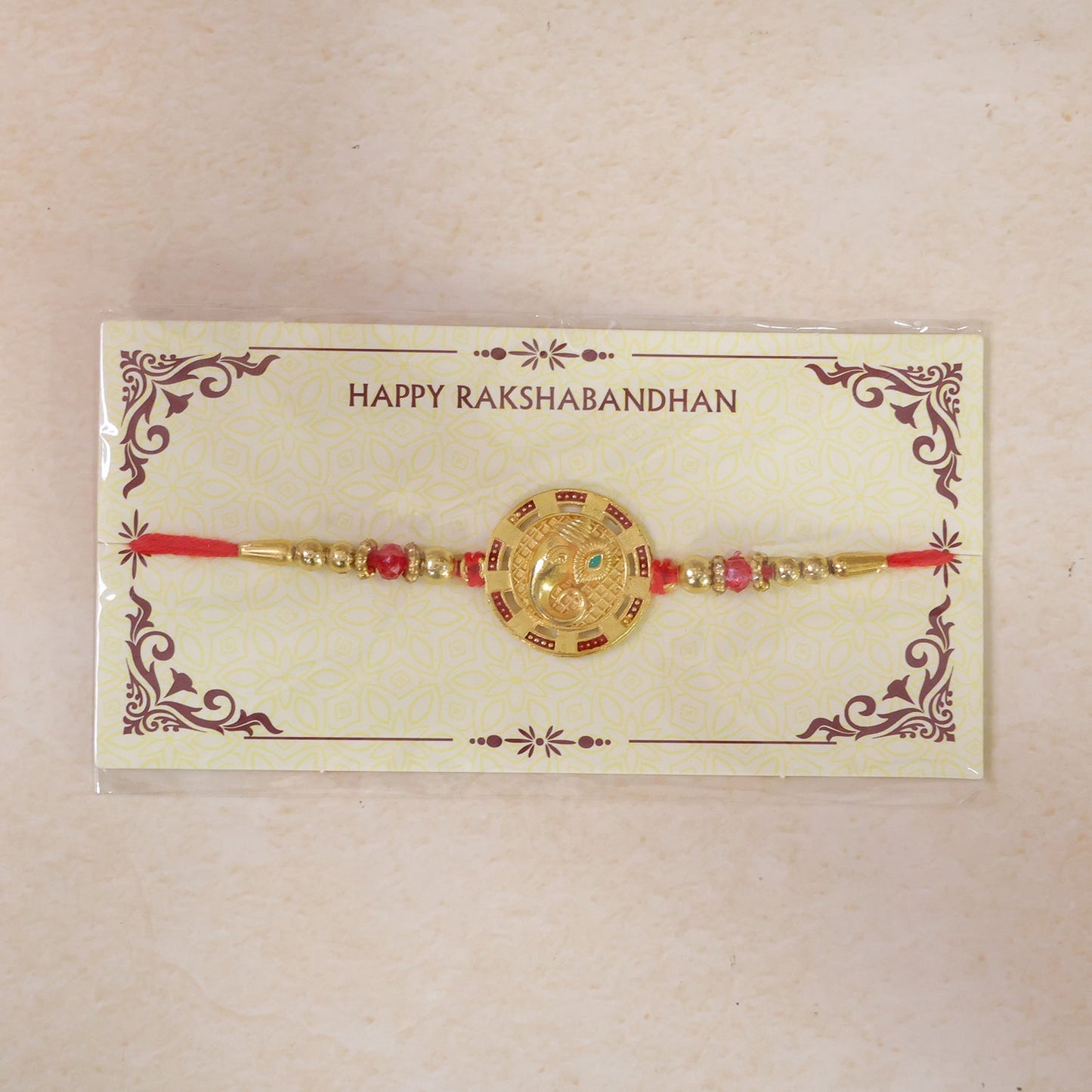 Round Ganesha Kundan Designer Rakhi with Beaded Festive Detail Pattern