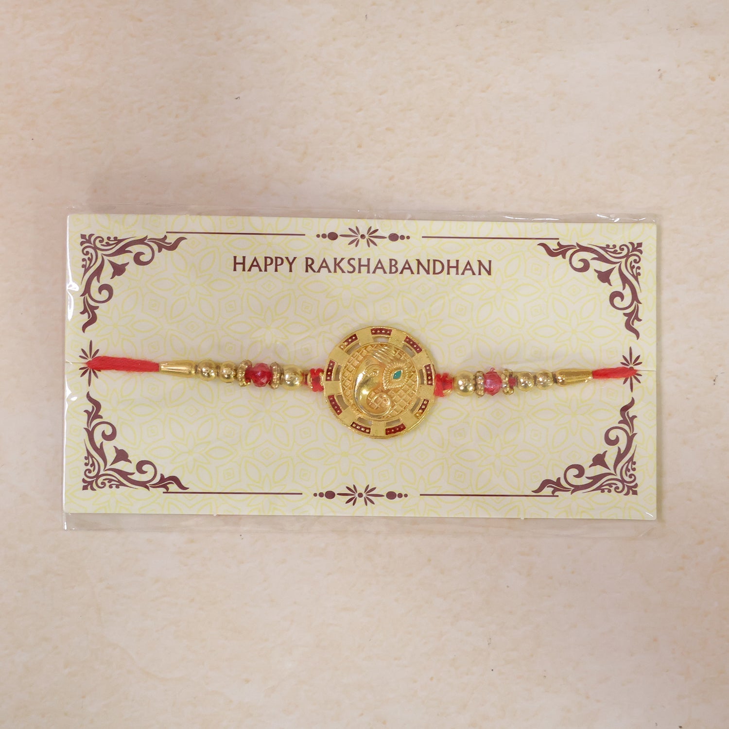 Round Ganesha Kundan Designer Rakhi with Beaded Festive Detail Pattern