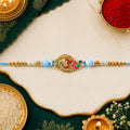 Om Motif Designer Rakhi with Pearl Beaded Traditional Detail