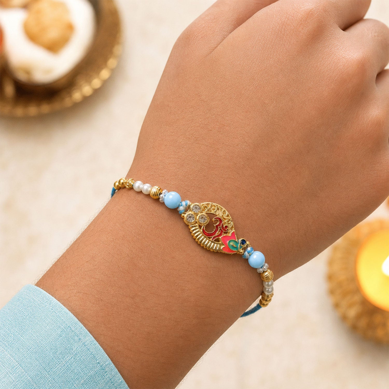 Om Motif Designer Rakhi with Pearl Beaded Traditional Detail