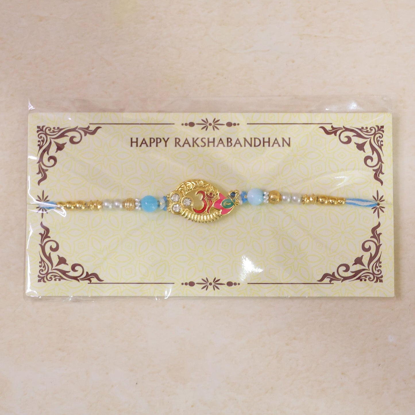 Om Motif Designer Rakhi with Pearl Beaded Traditional Detail