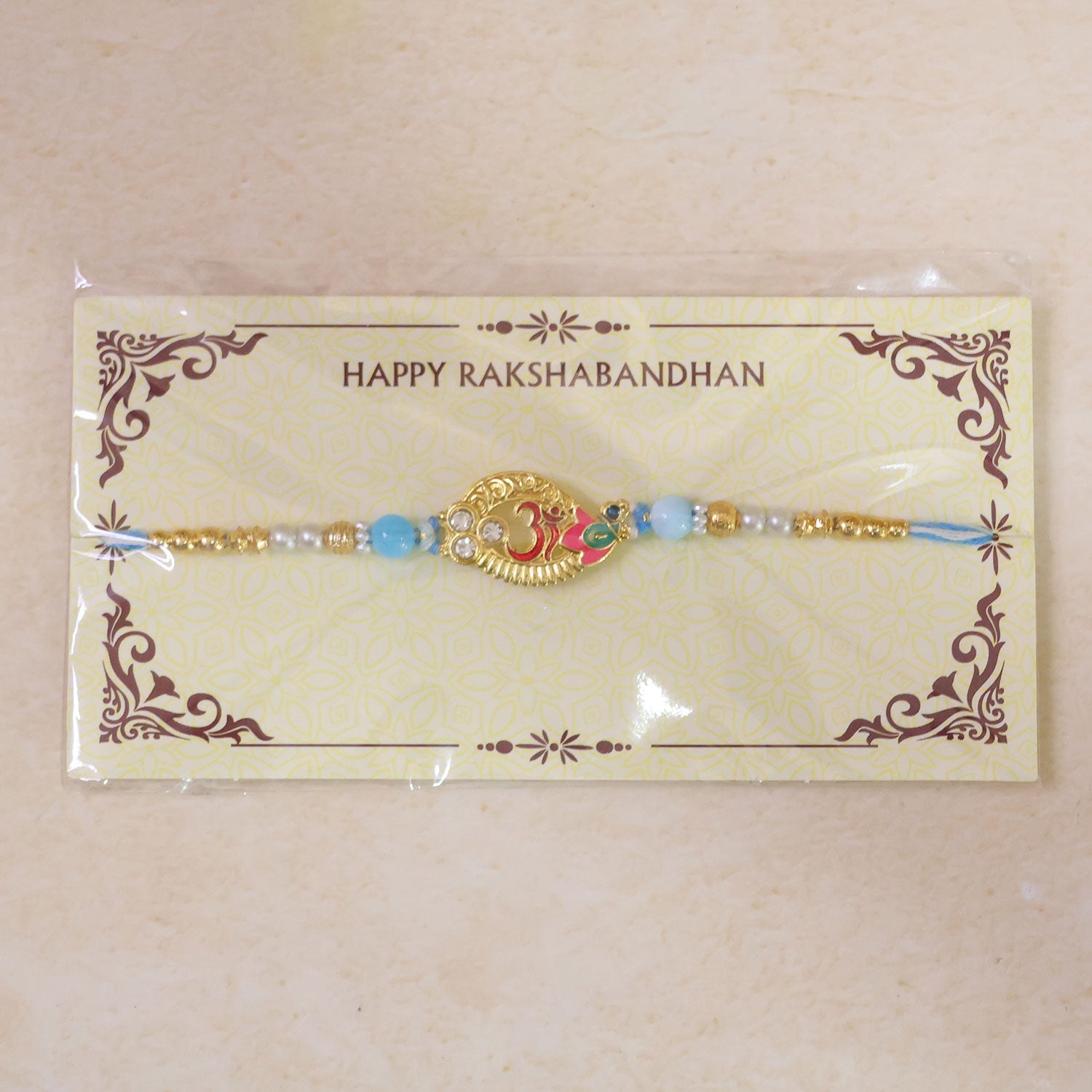 Om Motif Designer Rakhi with Pearl Beaded Traditional Detail