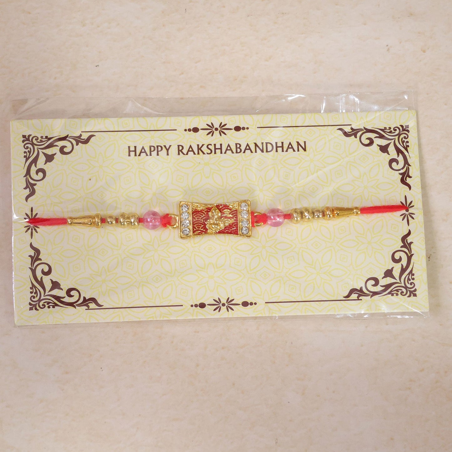 Ganesh Motif Designer Rakhi with Kundan Beaded Festive Detail