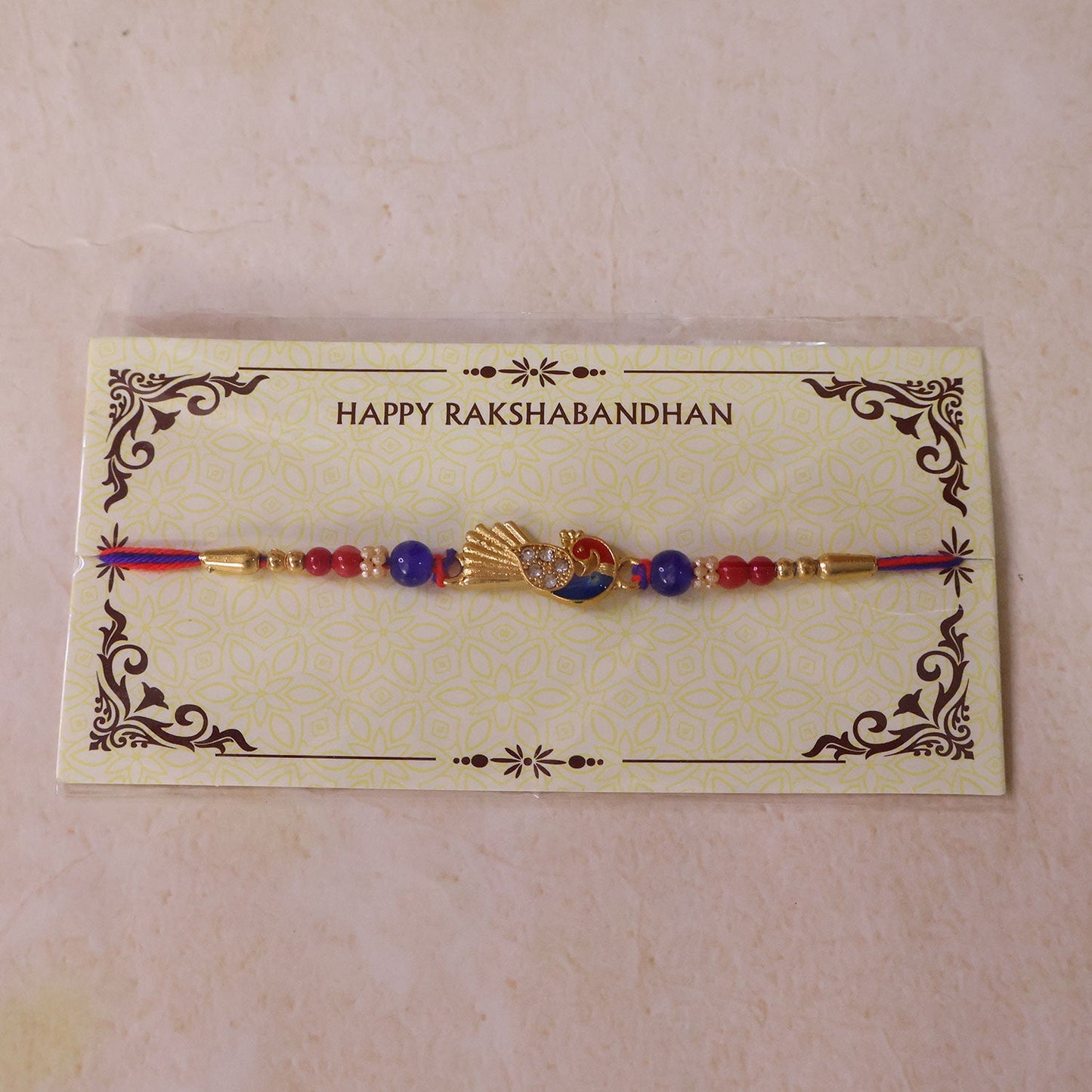 Peacock Charm Designer Rakhi with Beaded Traditional Detailing