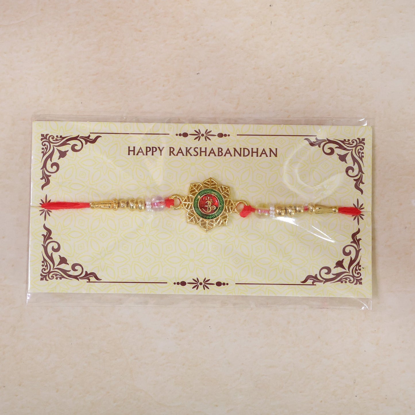 Round Om Motif Designer Rakhi with Beaded Traditional Detail