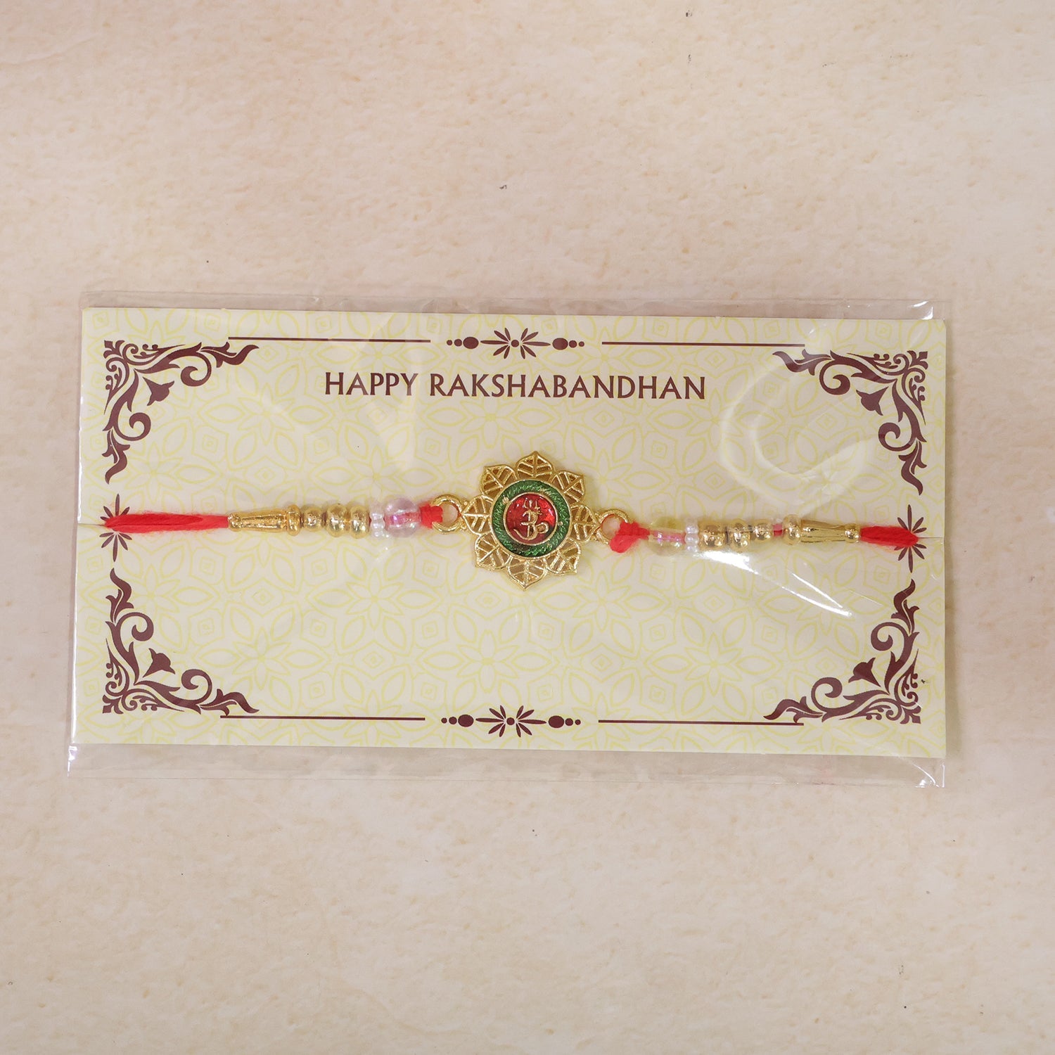 Round Om Motif Designer Rakhi with Beaded Traditional Detail