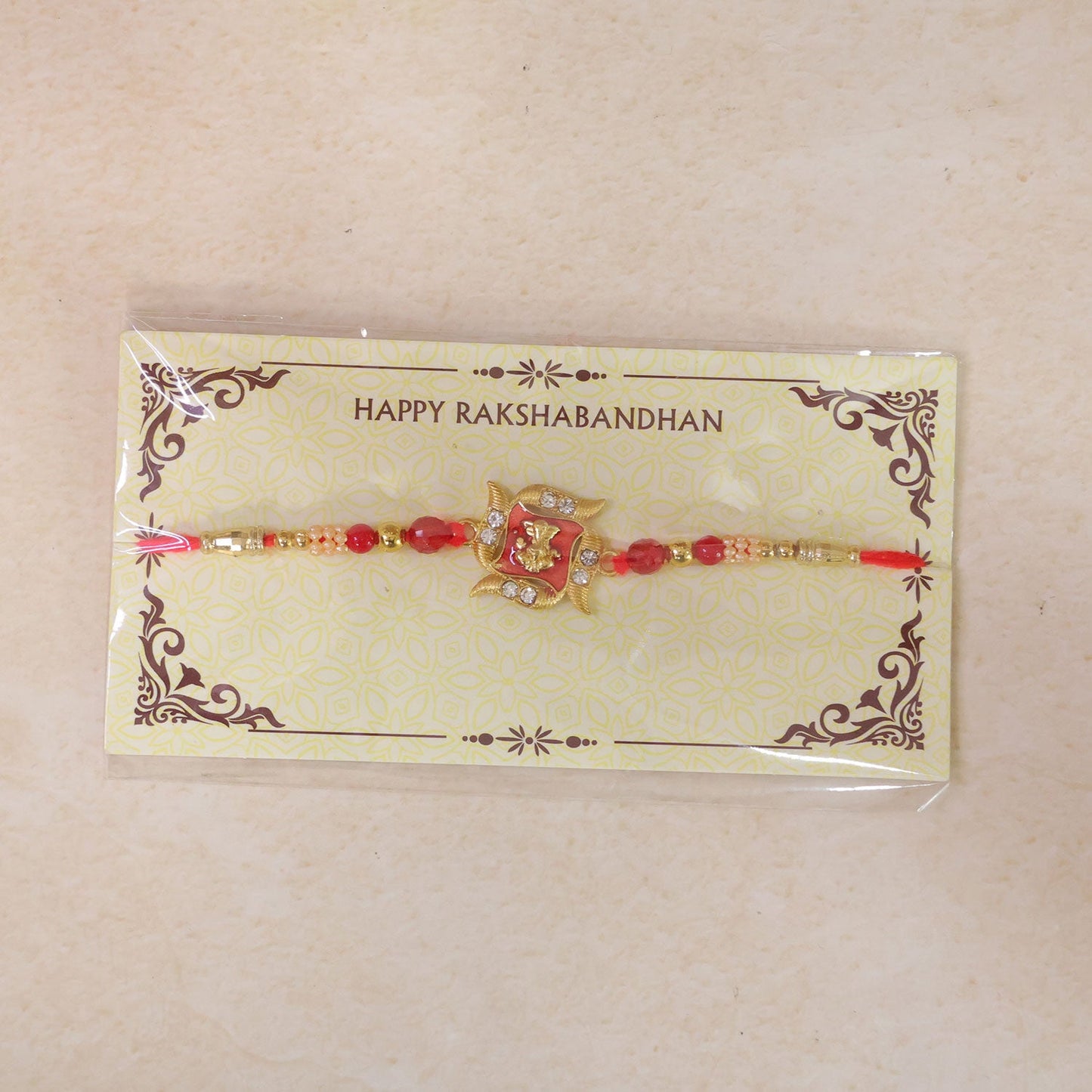 Ganesha Motif Designer Rakhi with Stone Beaded Festive Detail