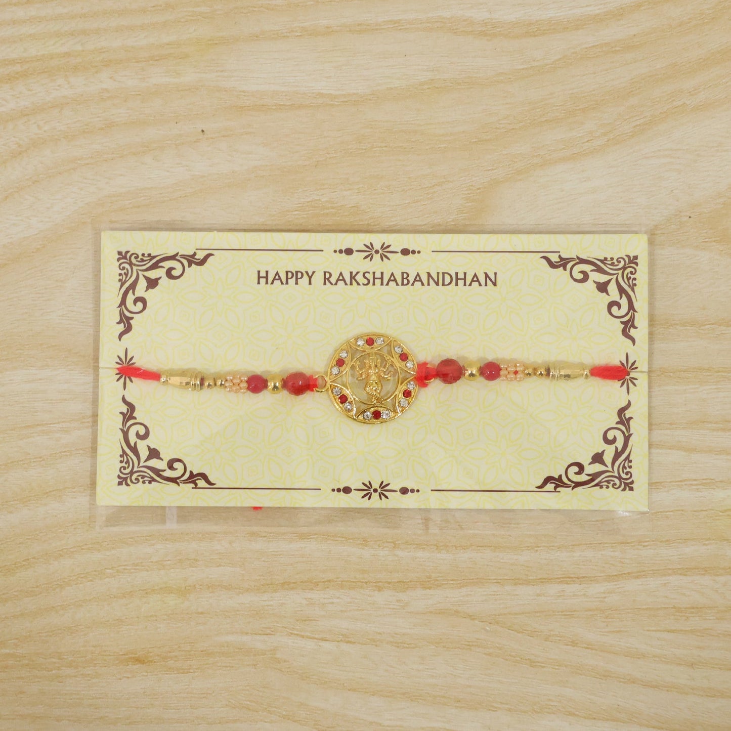 Ganesha Motif Round Designer Rakhi with Stone Beaded Festive Detail Pattern