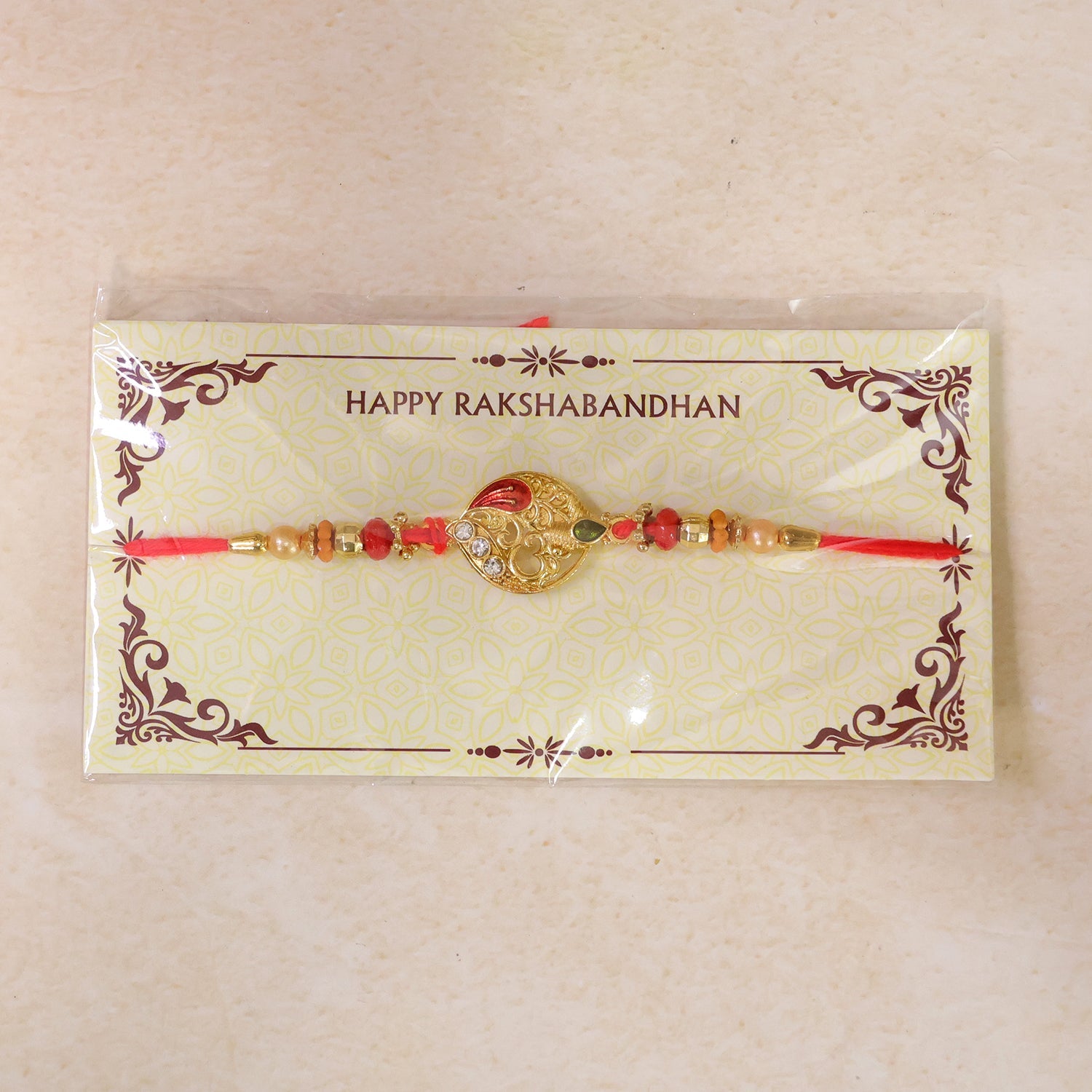 Leaf Om Om Designer Rakhi with Pearl Beaded Festive Detail Pattern