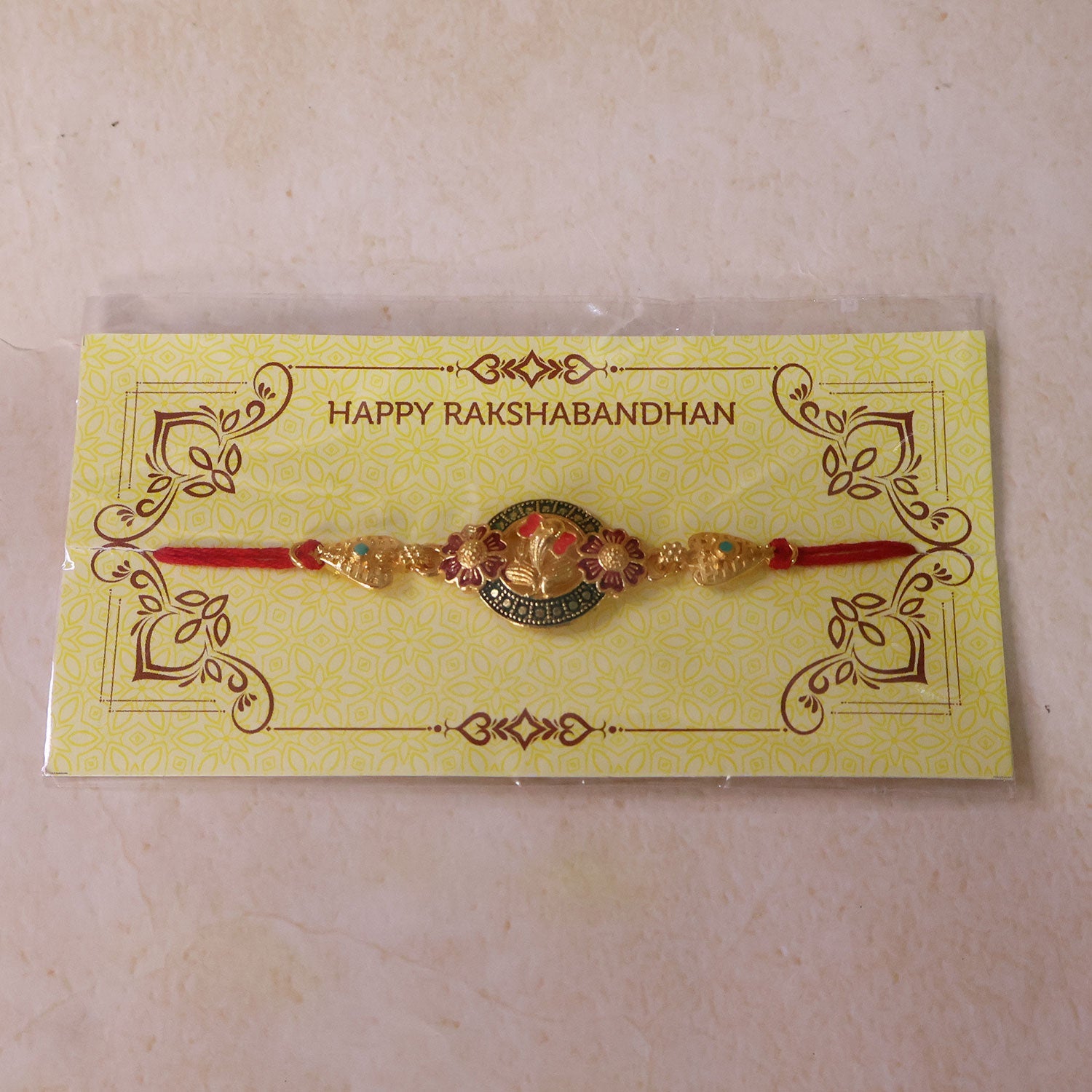 Ganesha Floral Designer Rakhi with Beaded Traditional Detailing