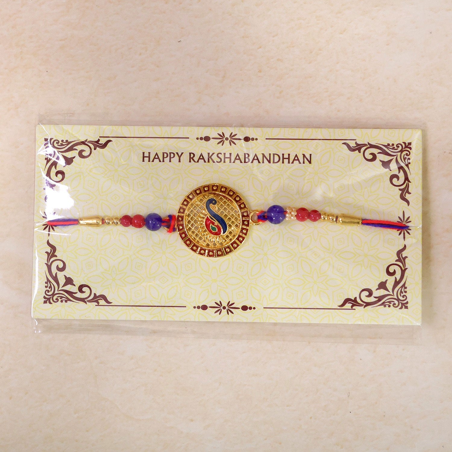 Peacock Paisley Stone Designer Rakhi with Beaded Traditional Detailing