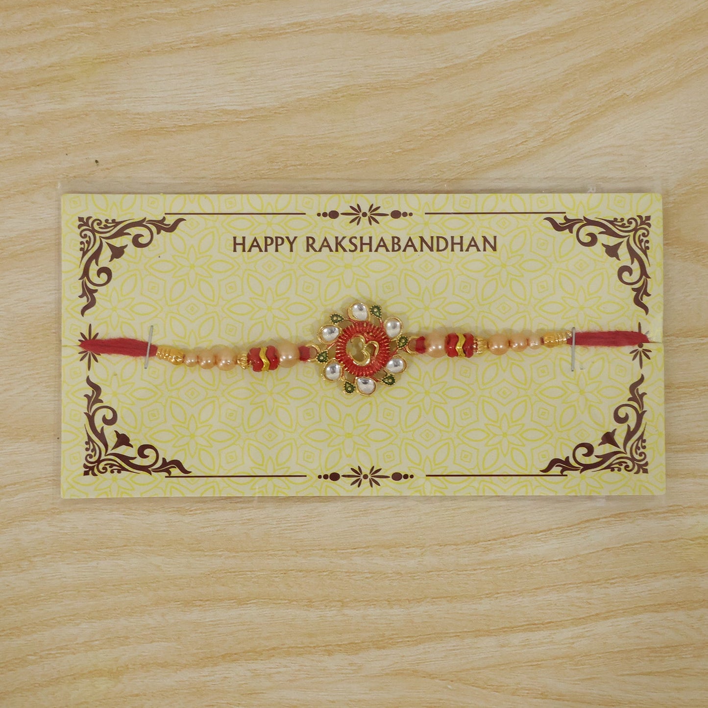 Premium Om Motif Rakhi with Decorative Beads for Brother