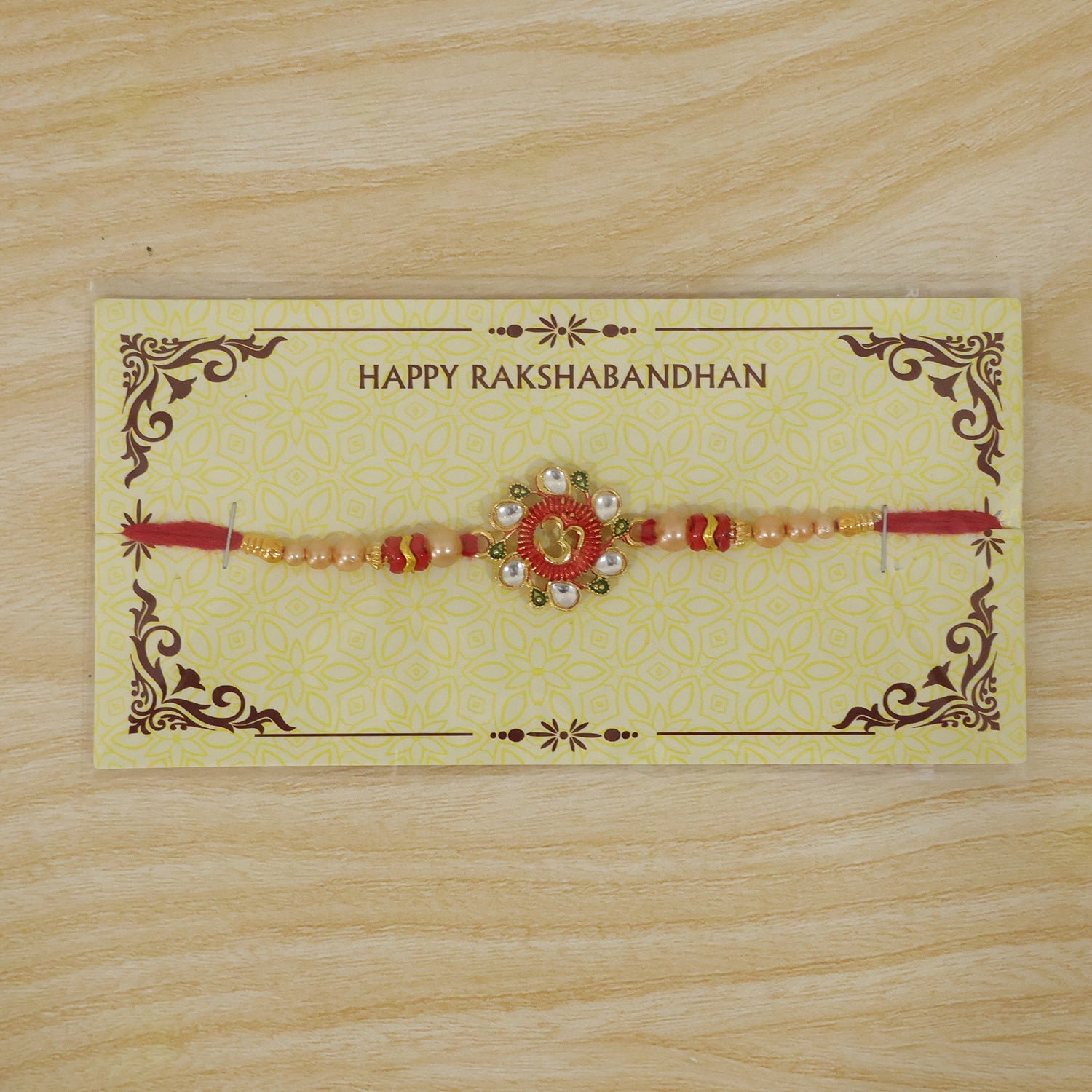 Premium Om Motif Rakhi with Decorative Beads for Brother