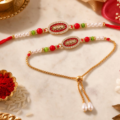 Two ornate red and gold beaded bracelets with oval centers and pearl accents rest on a white marble surface with rice and