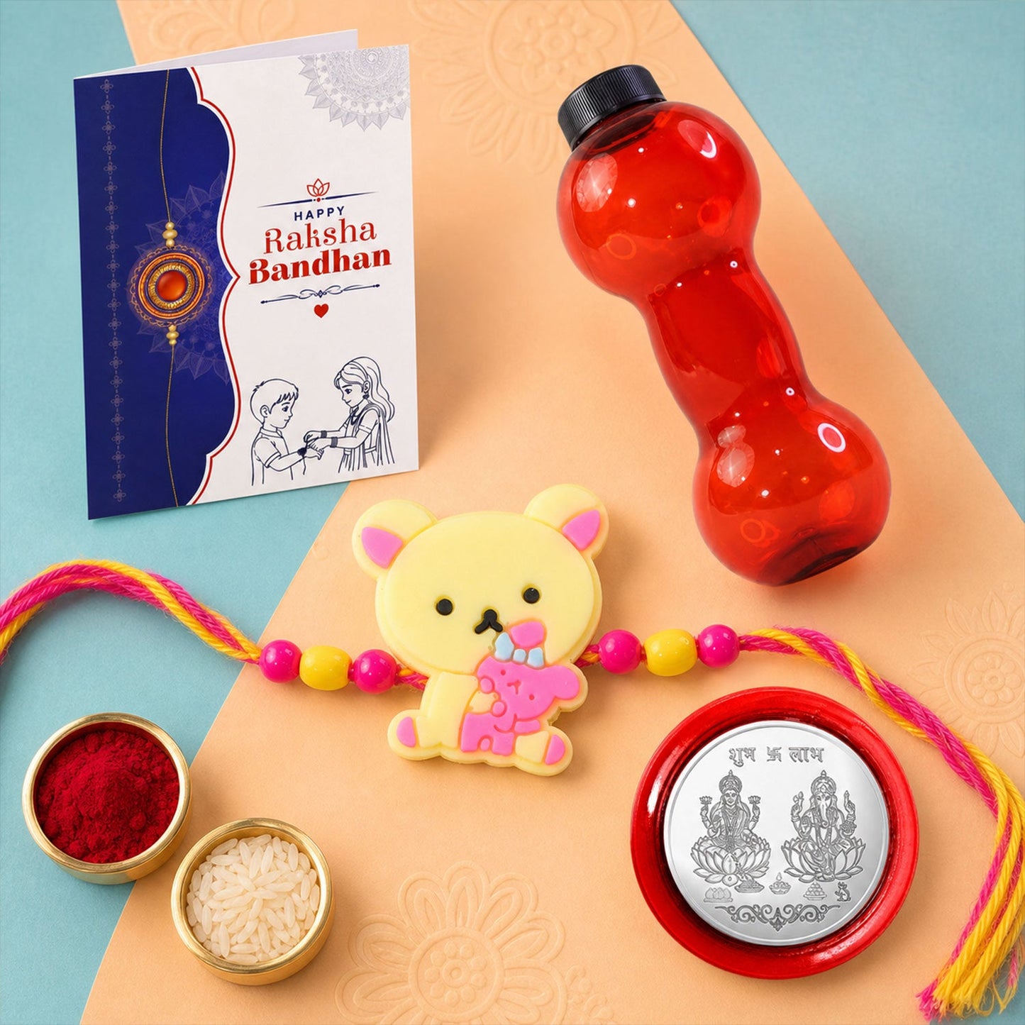 Cute Teddy Bear Rakhi with Water Bottle Gift Combo - Kids Rakhi, Silver-Plated Coin, Roli Chawal & Greeting Card