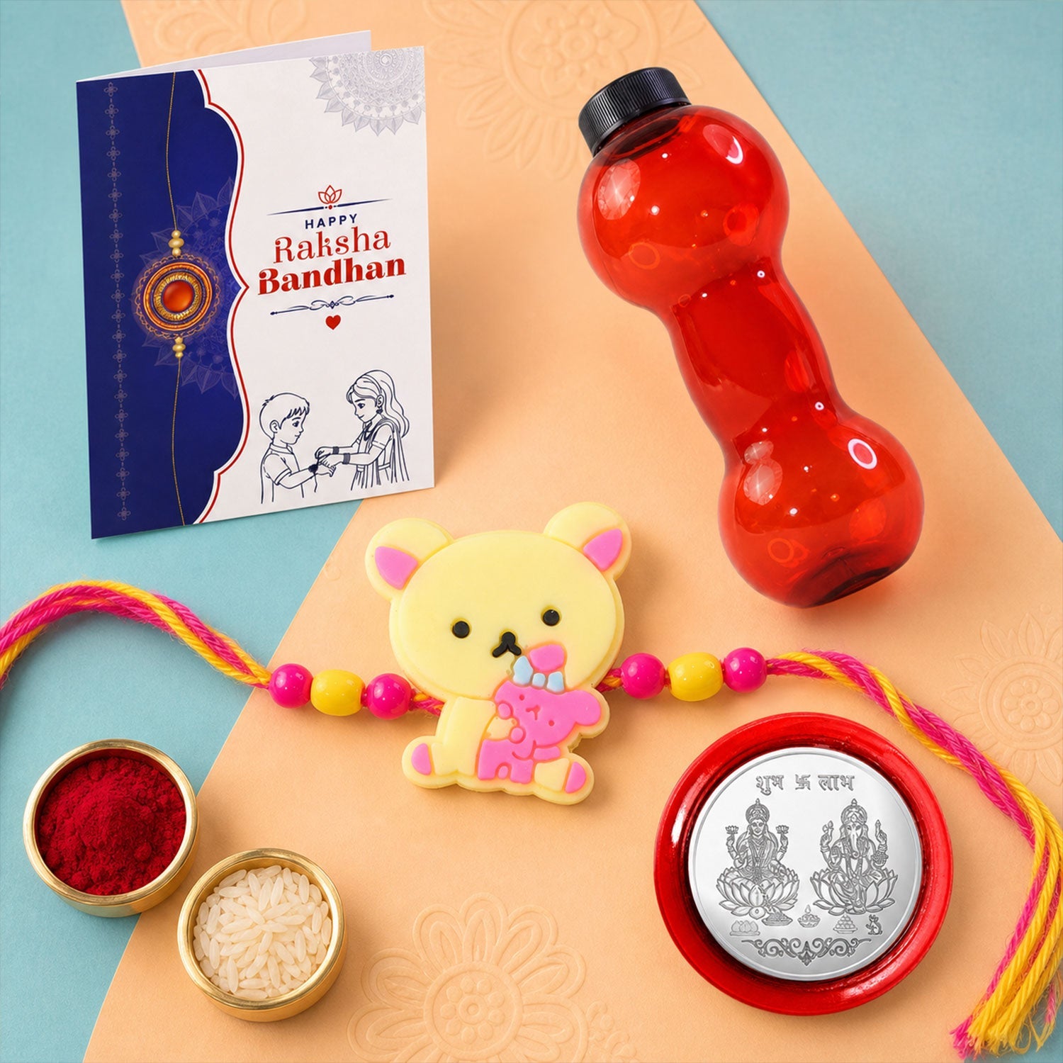 Cute Teddy Bear Rakhi with Water Bottle Gift Combo - Kids Rakhi, Silver-Plated Coin, Roli Chawal & Greeting Card