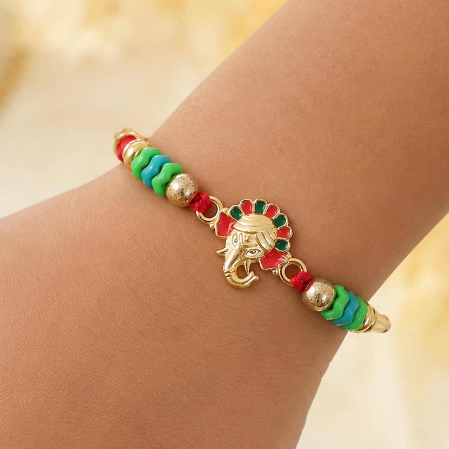 Ganesha Kundan Beaded Rakhi with Royal Crown Center Charm Design