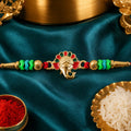 Ganesha Kundan Beaded Rakhi with Royal Crown Center Charm Design