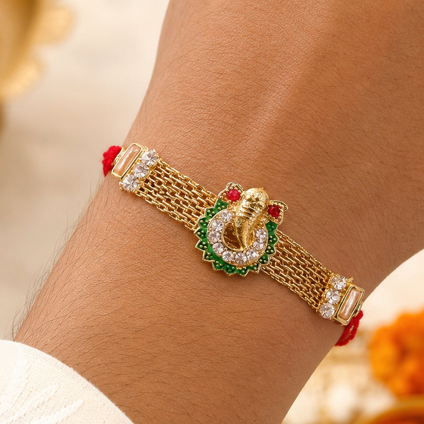 Ganesha Charm Rakhi with Elegant Stone Center Motif Design