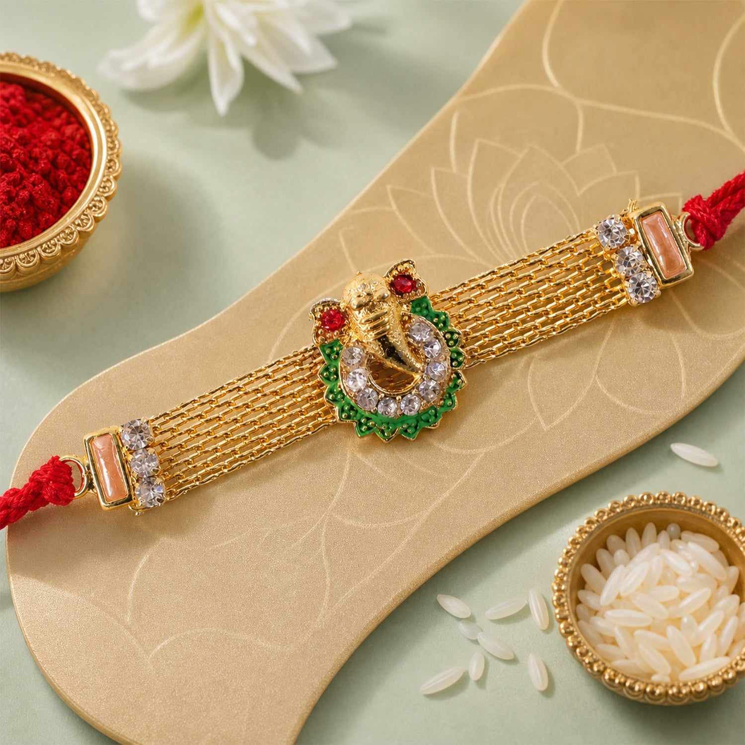 Ganesha Charm Rakhi with Elegant Stone Center Motif Design