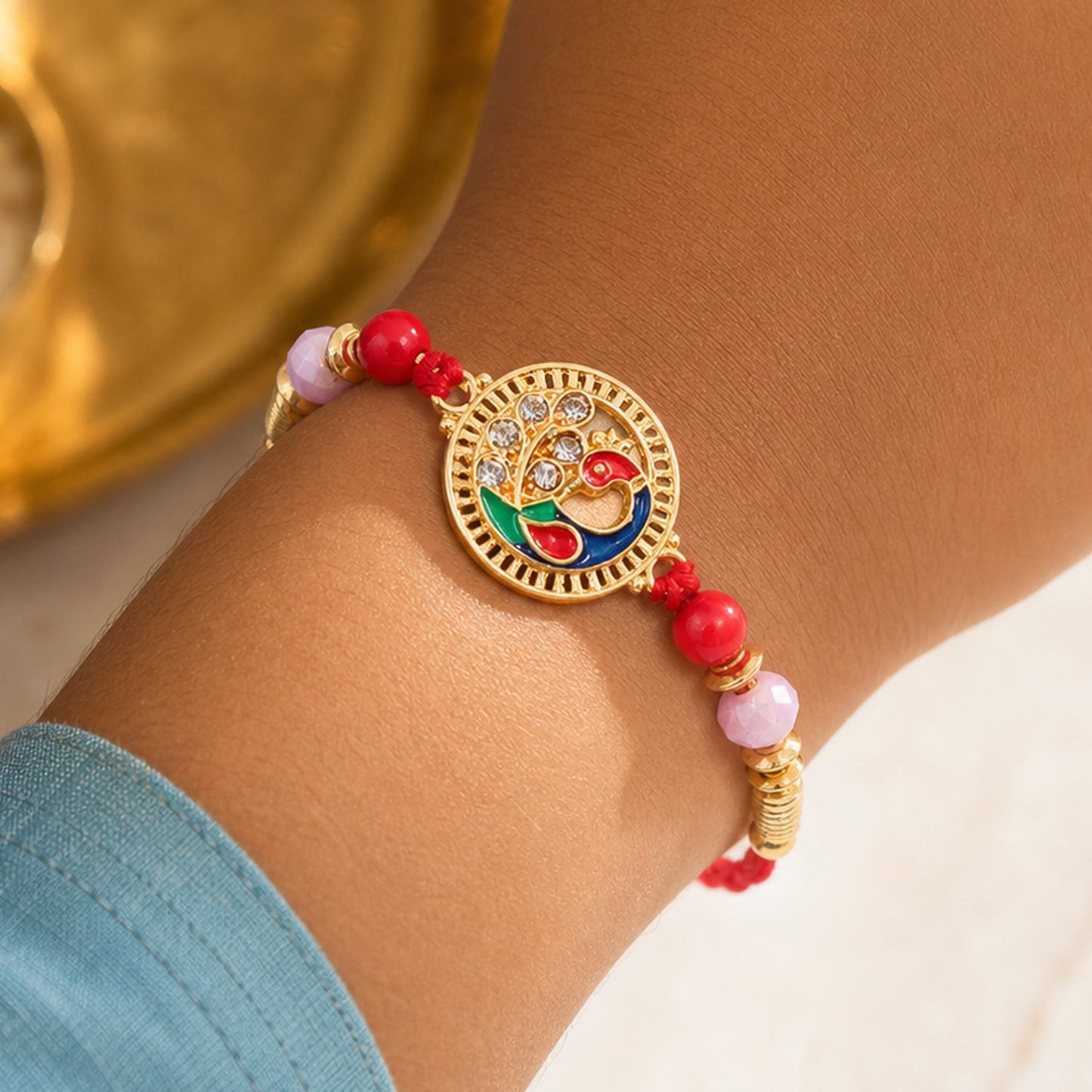 Premium Round Peacock Rakhi with Pearl Beads and Sacred Charm Design