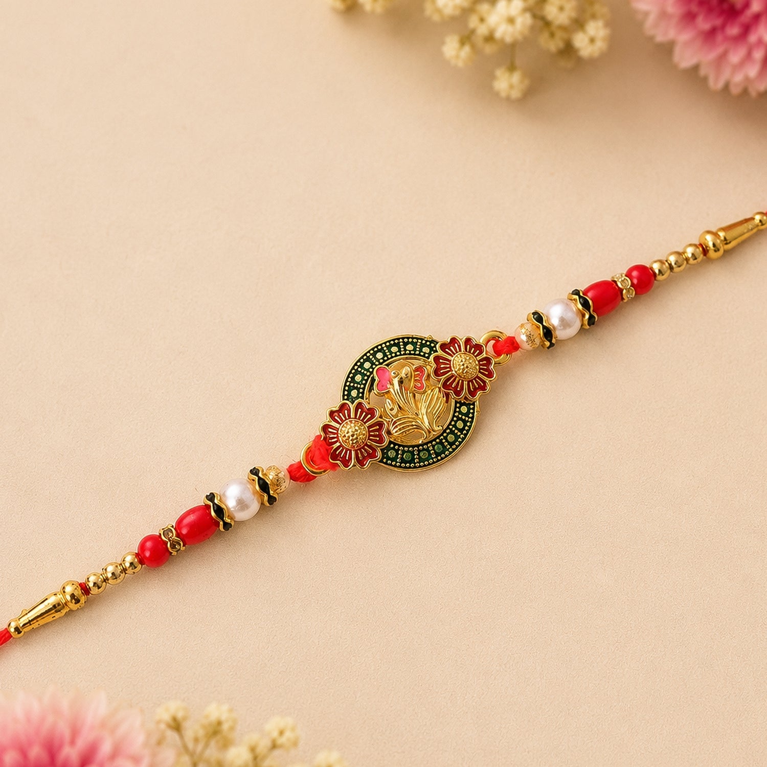 Stylish Ganesh Motif Rakhi with Ornamental Beaded Center Design