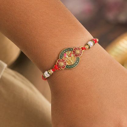 Stylish Ganesh Motif Rakhi with Ornamental Beaded Center Design