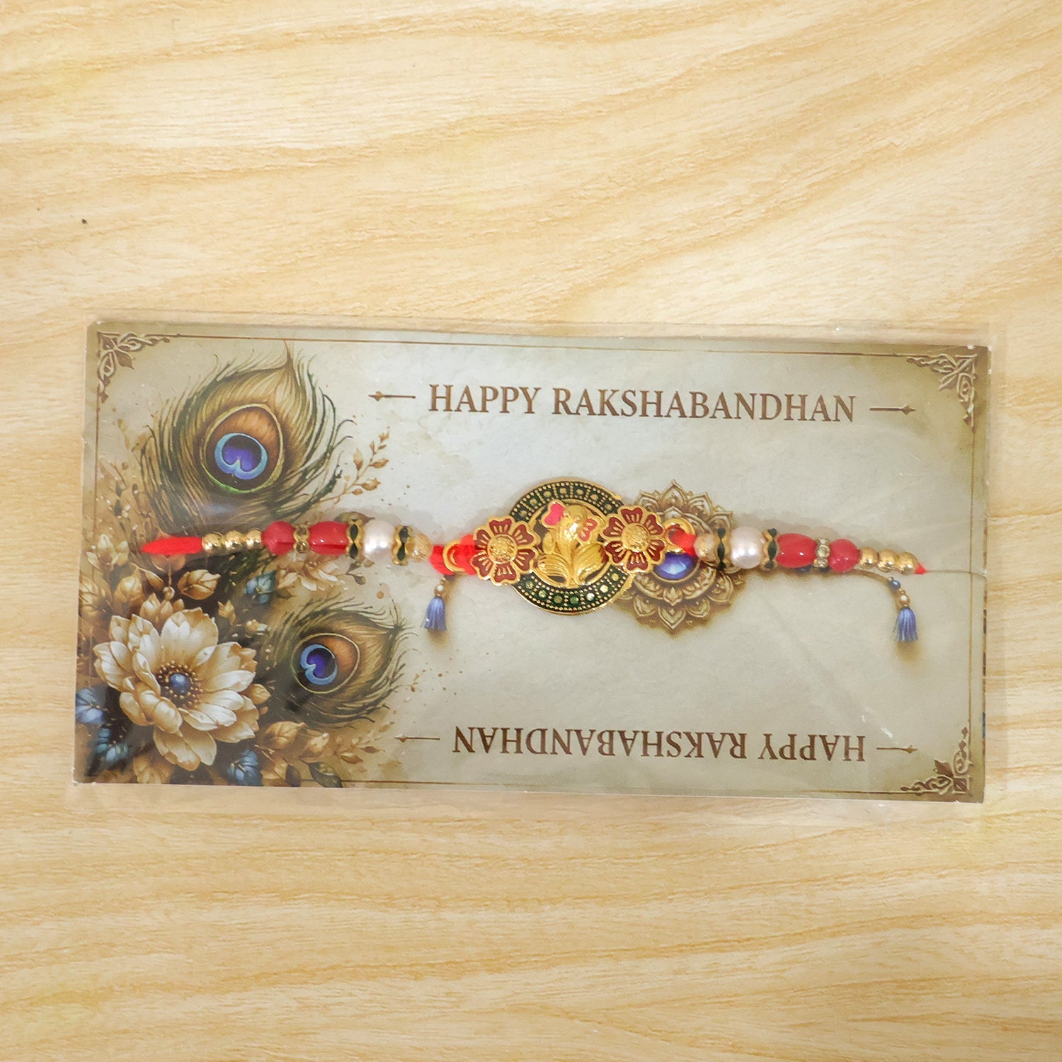 Stylish Ganesh Motif Rakhi with Ornamental Beaded Center Design