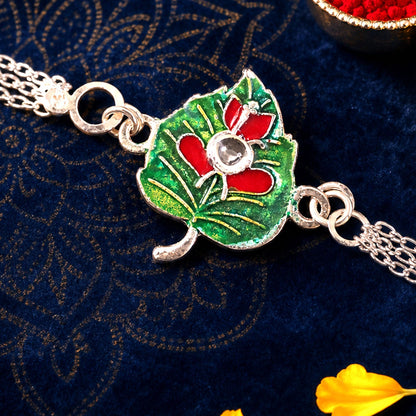 Leaf Ganesha Motif Stone Rakhi with Elegant Chain Center Detail Design