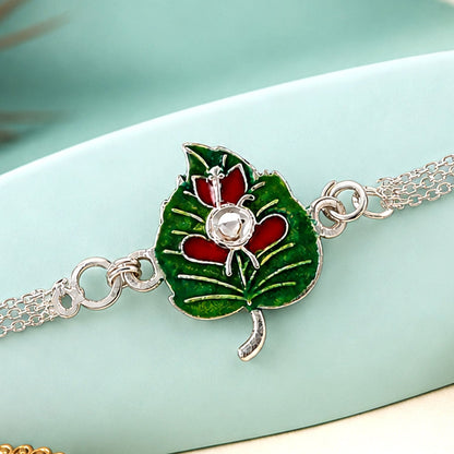 Leaf Ganesha Motif Stone Rakhi with Elegant Chain Center Detail Design