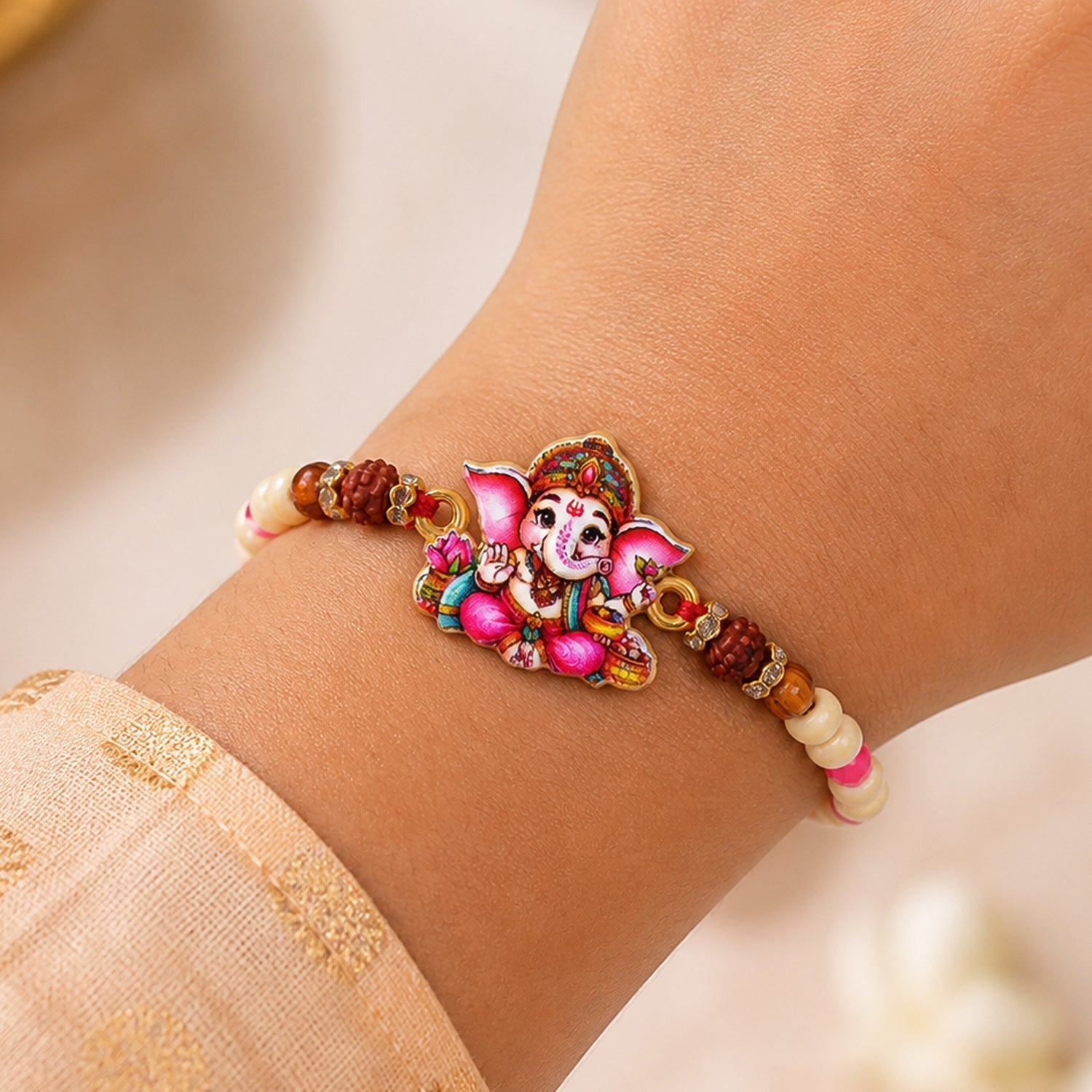 Cute Ganesha Pearl Beaded Rakhi with Playful Center Charm Design
