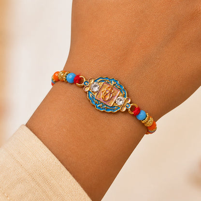 Round Ganesha Motif Stone Rakhi with Pearl Beads and Sacred Center Detail