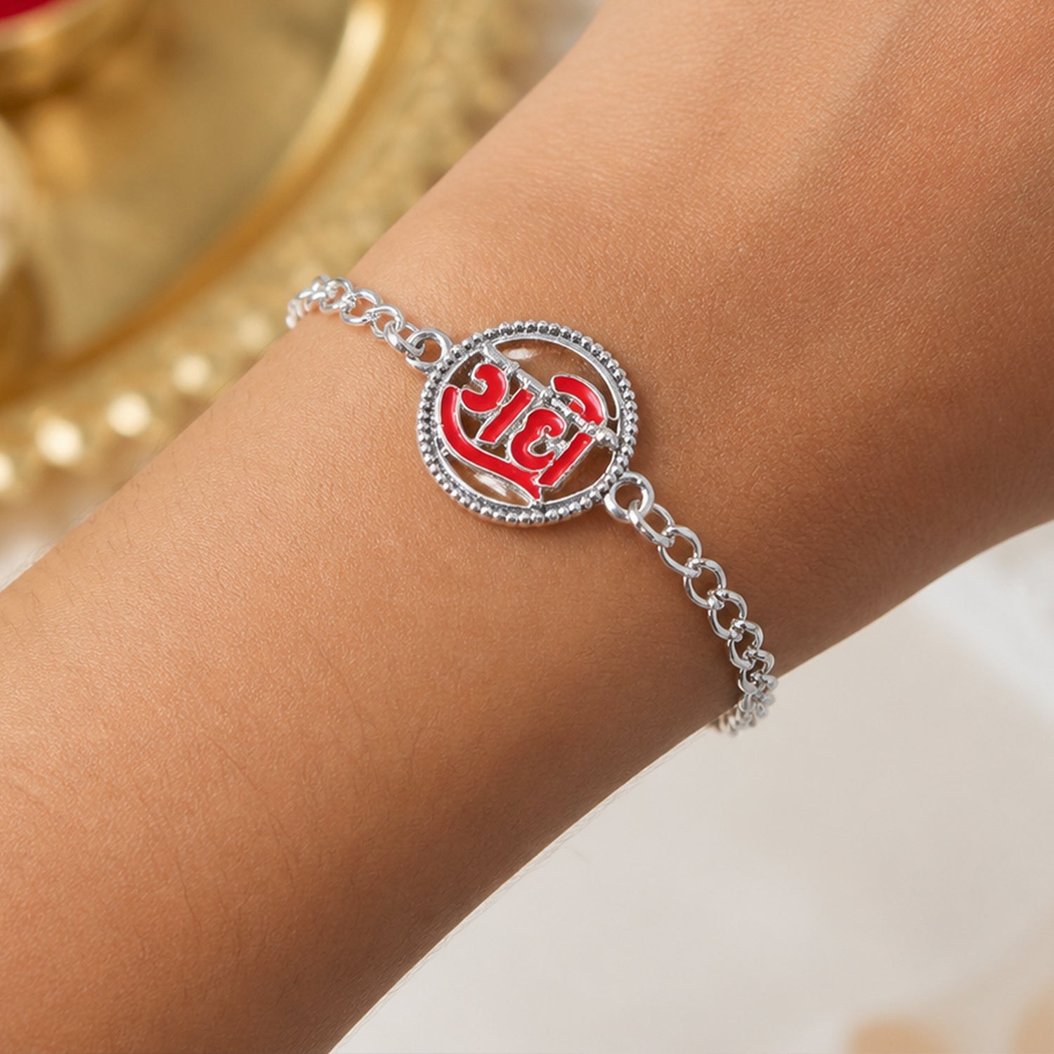 Radhe Motif Chain Rakhi with Traditional Sacred Center Design