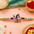 Floral Charm, Lord Krishna & Meenakari Peacock Beads Rakhi for Brother (3 Pc Set)