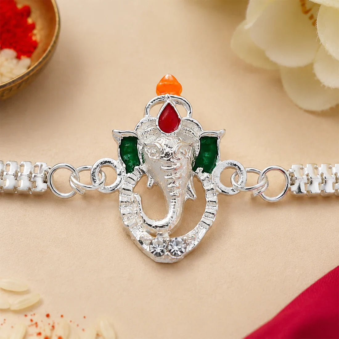 Stylish Ganesha Chain, Gold Pearl Round & Om Peacock Rakhi for Brother (3 Pc Set)