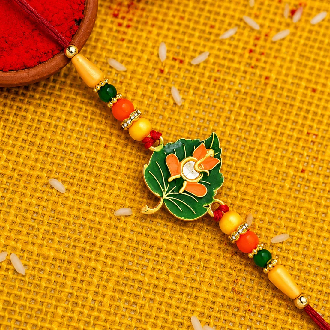 Green Tulsi Leaf, Evil Eye Floral Petal & Ganpati Design Rakhi for Brother (3 Pc)