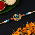 Golden Ganpati Beads, Rakhi Ki Dori & Peacock Beads Rakhi for Brother (3 Pc Set)